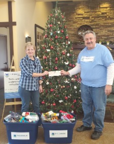 Annual donation and check presentation to The Drawer